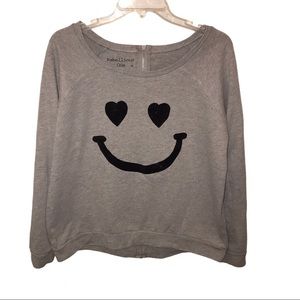 Boat neck smiley face sweatshirt.